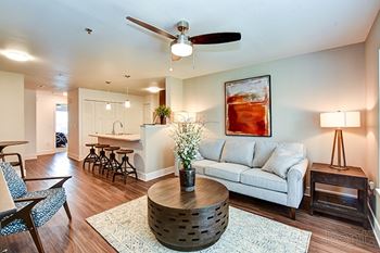 A living room with a white couch at Chase Creek Apartment Homes, Huntsville, AL, 35811