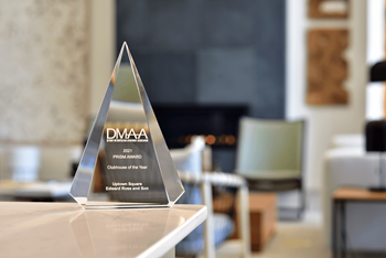 a dma award sits on a table in a living room  at Uptown Square Apartments, Troy