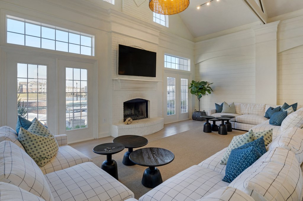 a living room filled with furniture and a fire place at Latitudes Apartments, Indianapolis, 46237