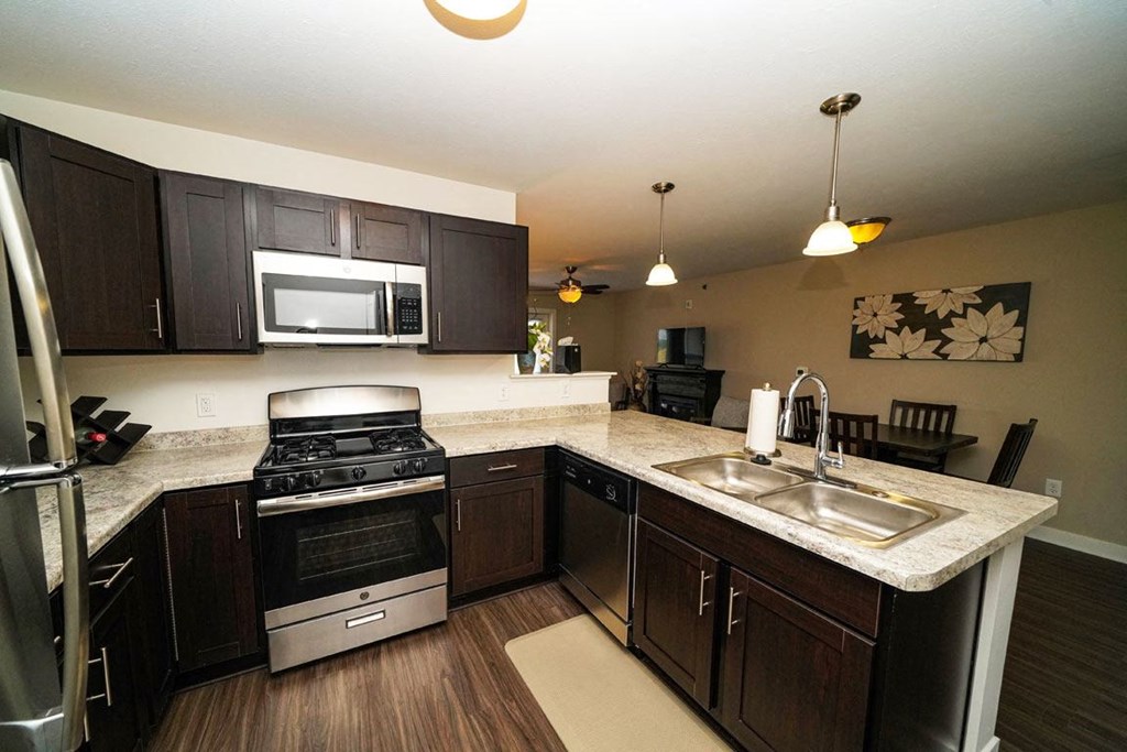 Dark Mocha Kitchen Cabinetry at Copper Creek Apartment Homes, Maize, Kansas