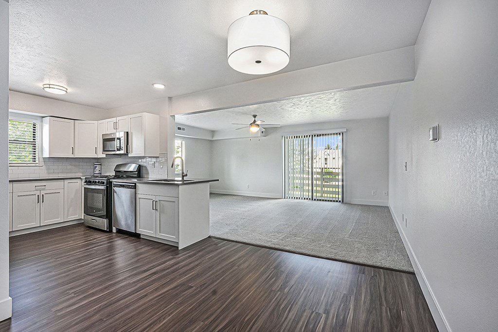 end style kitchen and living room at The Crossings Apartments, Michigan, 49508