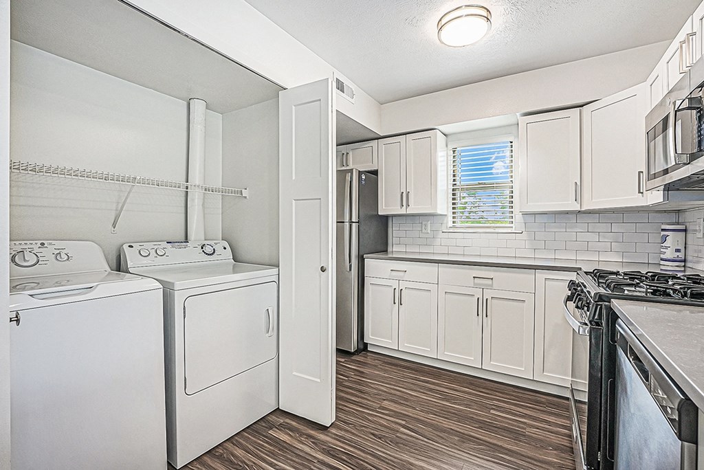 a kitchen with washer and dryer at The Crossings Apartments, Michigan, 49508