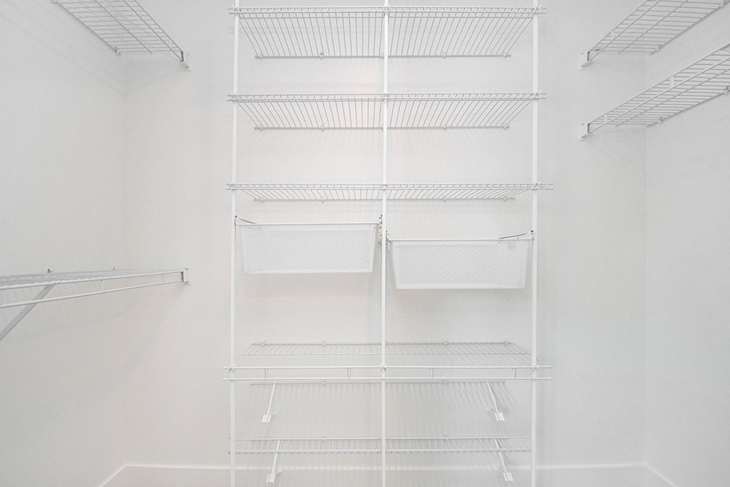 Large Walk In Closet with Wardrobe Organizers at The Crossings Apartments, Grand Rapids, Michigan