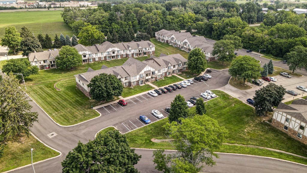 arial view of a subdivision with houses and parking lot at Beacon Hill and Great Oaks Apartments, Illinois, 61109