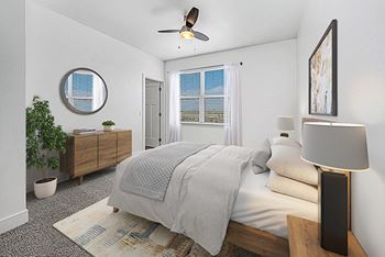 A bedroom with a ceiling fan at Dodson Pointe Apartment Homes, Rogers, AR