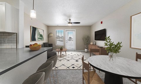 A modern kitchen with a dining table and chairs.
