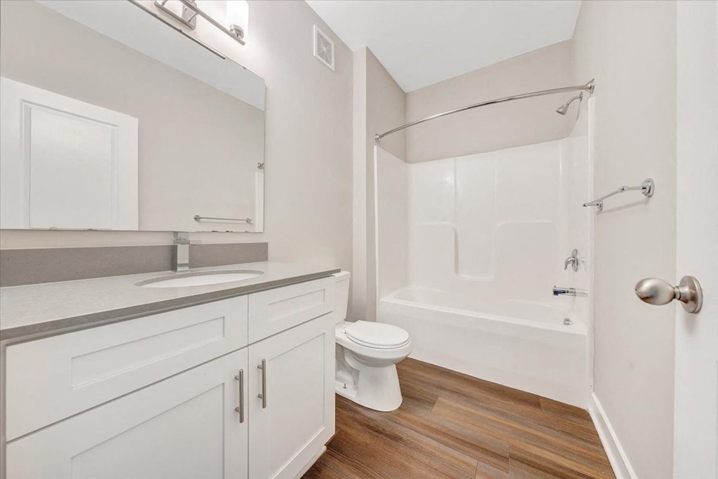 a bathroom with a sink toilet and a shower