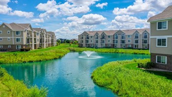 Lake With Lush Natural Surrounding Lake With Lush Natural Surrounding at Fieldstream Apartment Homes, Ankeny, IA, 50023 - Photo Gallery 4