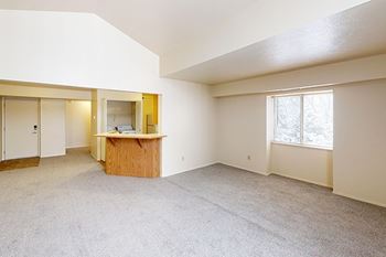 An enlarged living room with an extra window at Foxwood and The Hermitage, Portage, MI