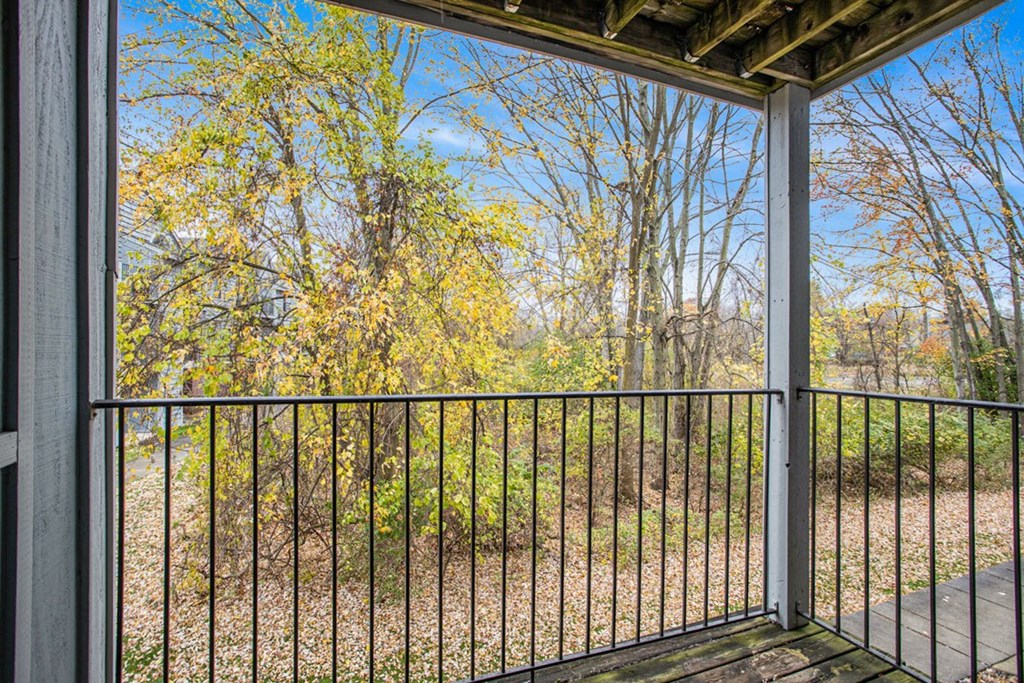 a balcony with a view of trees at Glenn Valley Apartments in Battle Creek, MI