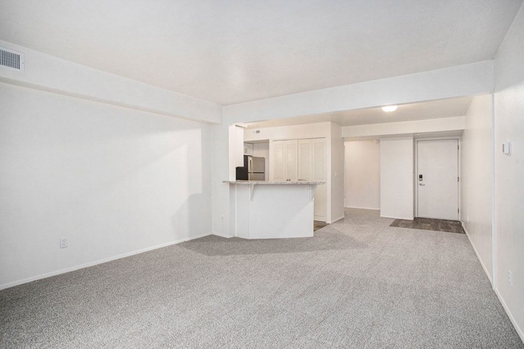 the dining room and kitchen of an upgraded apartment at Glenn Valley Apartments in Battle Creek, MI