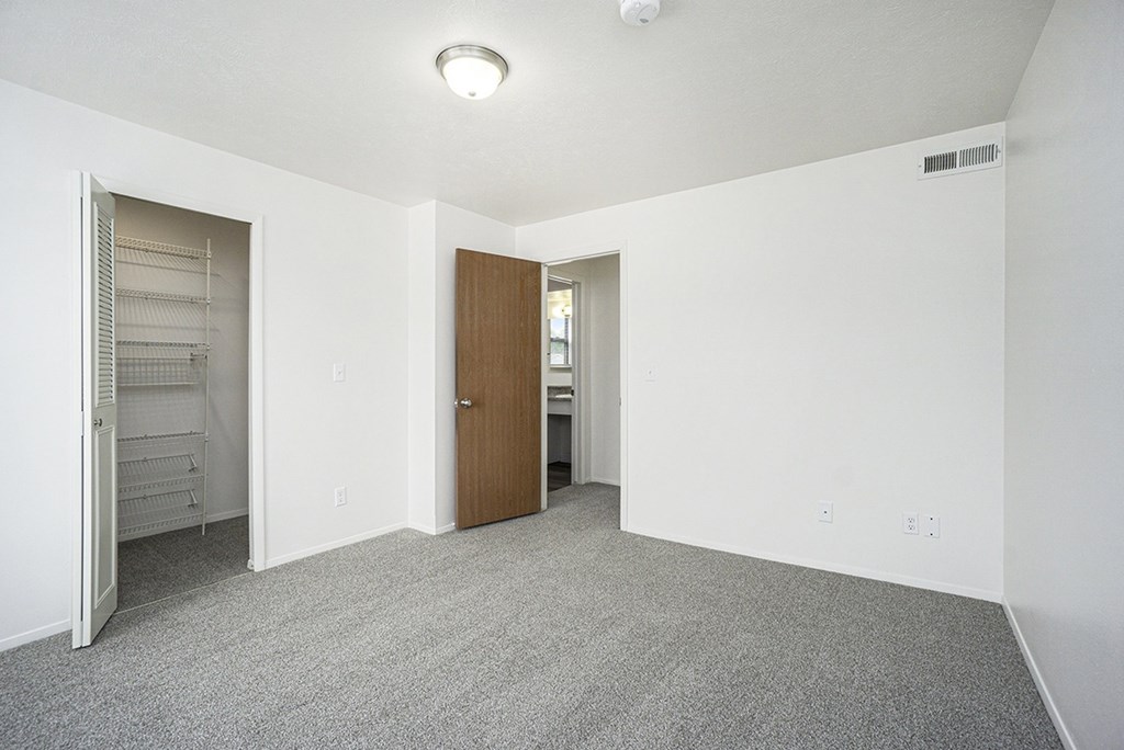 Bedroom with a door to a walk-in closet at Glenn Valley Apartments, Michigan, 49015
