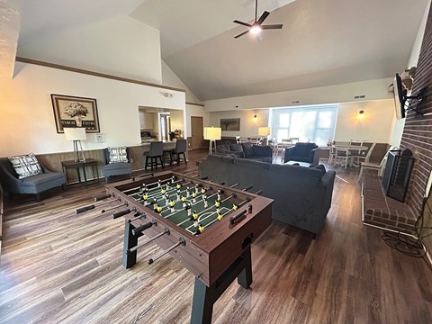 A foosball table in the middle of a living room.