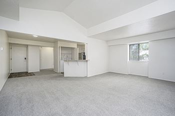 Enlarged living room with an extra window and cathedral ceiling at Glenn Valley Apartments in Battle Creek, MI
