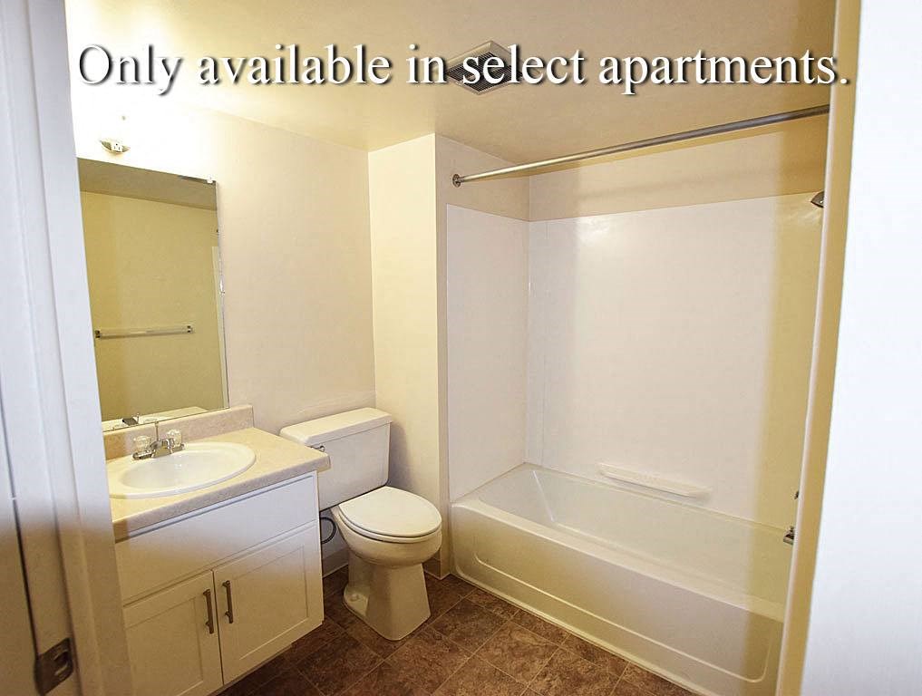 Updated Bathroom Cabinetry and Flooring at Granada Apartments in Jackson, MI