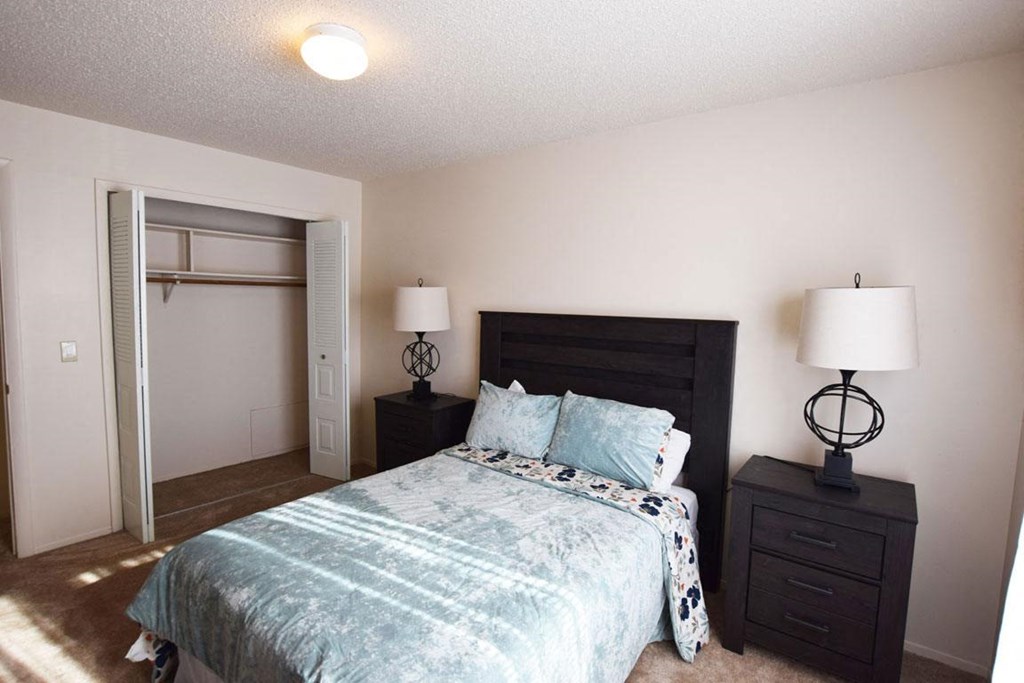 Spacious  Bedroom with Large Closet at Granada Apartments in Jackson, MI