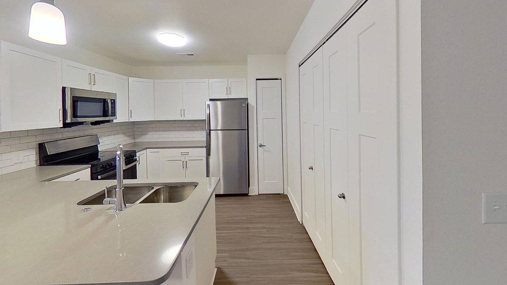 Kitchen Sink With Faucet at The Grove Apartment Homes, Nebraska