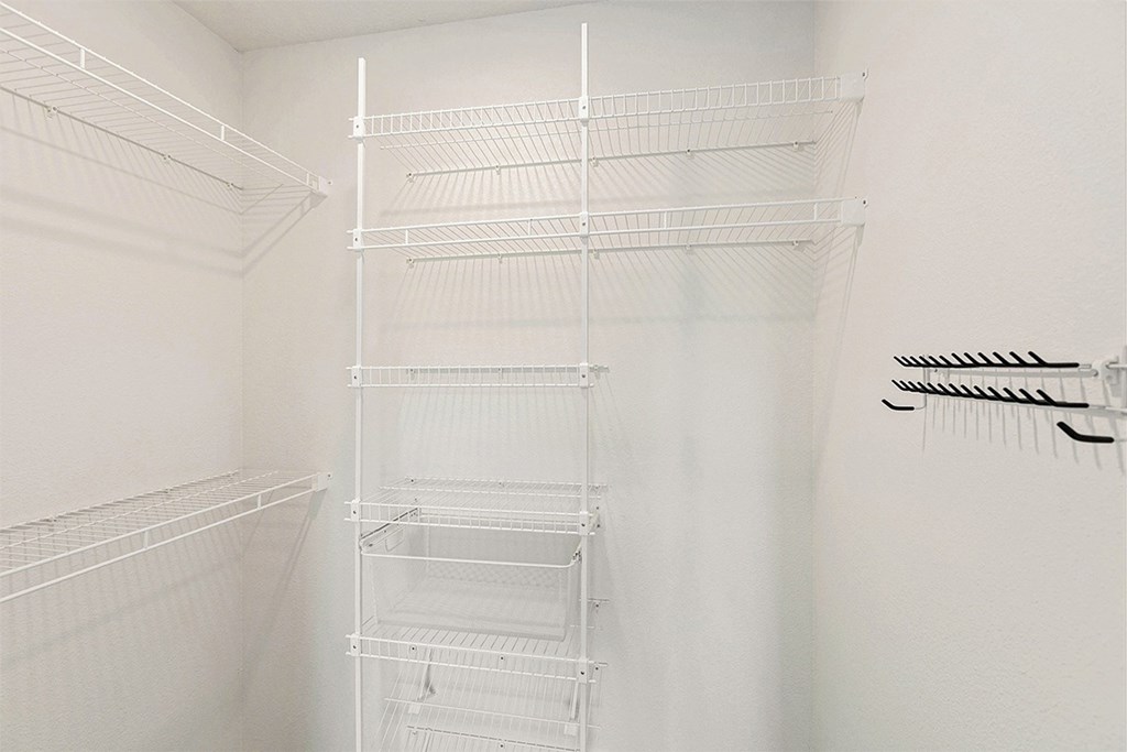 A walk-in closet at The Grove Apartment Homes, Nebraska, 68512