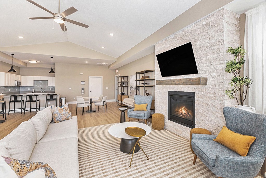 Community Room With Fireplace And TV at The Grove Apartment Homes, Lincoln Nebraska