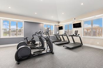 A 24/7 fitness center at The Grove Apartment Homes, Lincoln, NE 68512