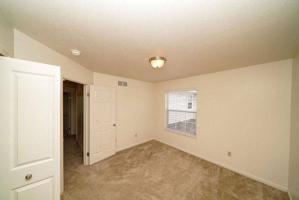 Large Bedroom with Closet and Window at Gull Prairie/Gull Run Apartments and Townhomes, Michigan