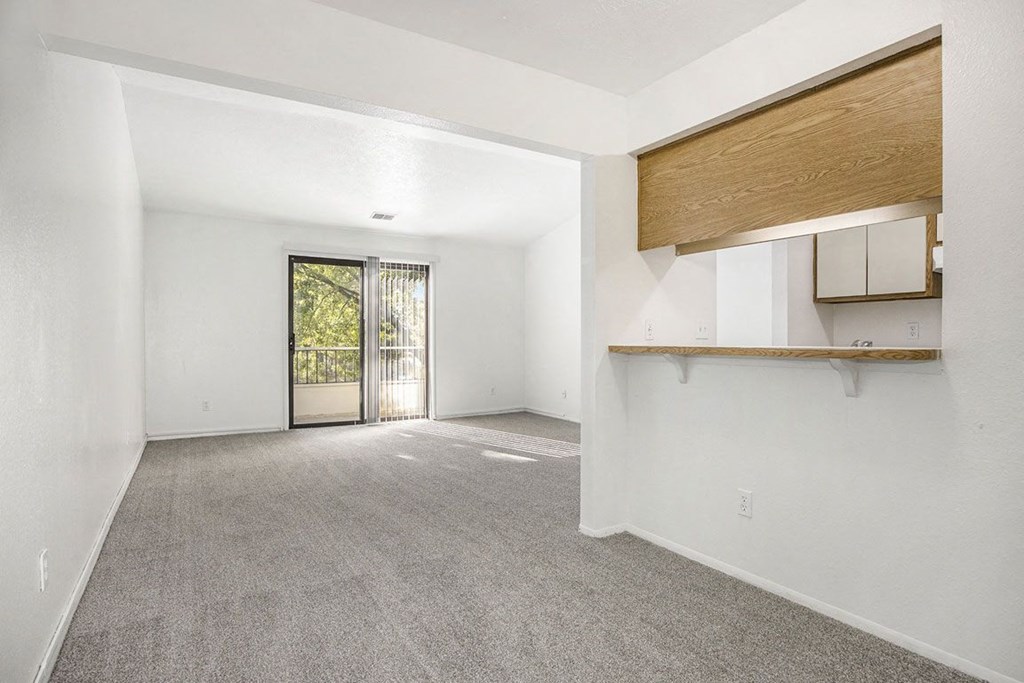 dining and living rooms with carpet at Hampton Lakes Apartments, Michigan, 49534