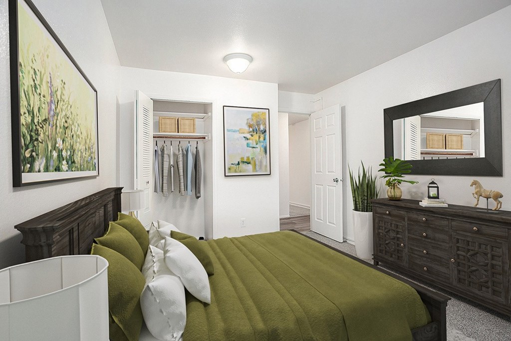 A bedroom with a closet, bed and a wooden dresser at Hampton Lakes Apartments, Michigan, 49534