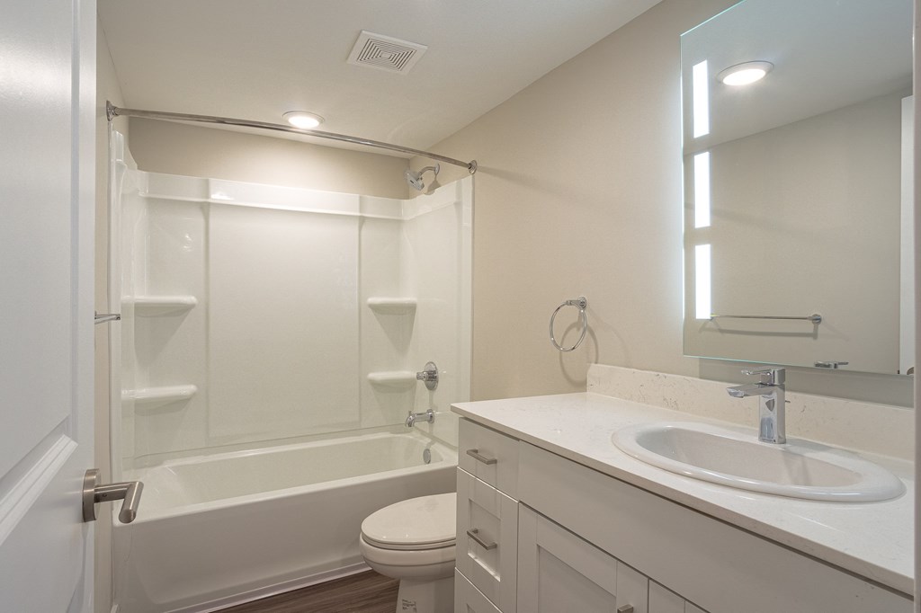 a bathroom with a sink toilet and bathtub at Hillside Apartments, Michigan
