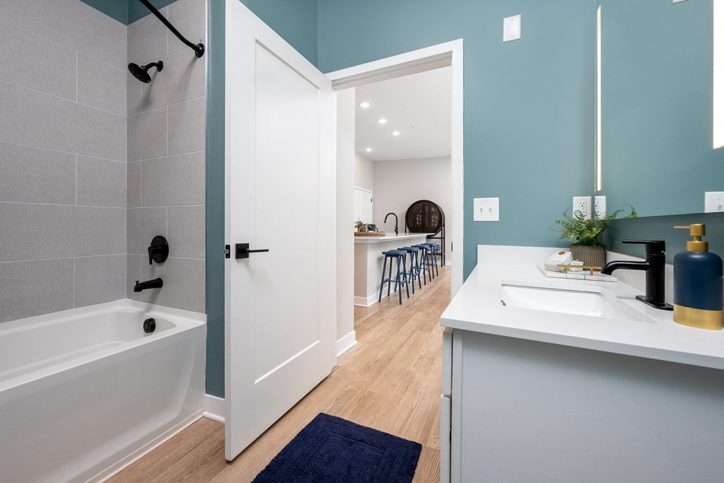 a bathroom with a bathtub and a sink  at Ironwood Flats, Brandon, 33511