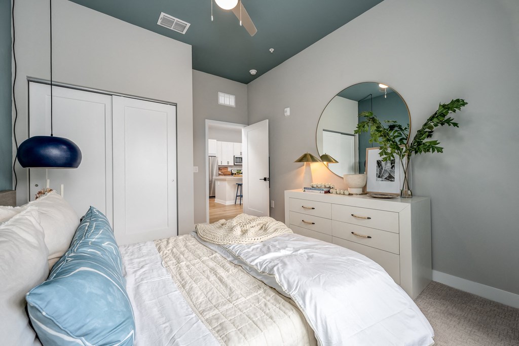 a bedroom with a bed and a dresser with a mirrorat Ironwood Flats, Brandon, FL, 33511