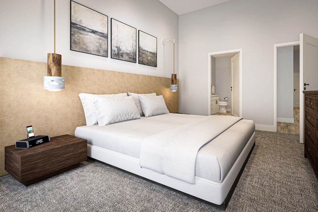 a bedroom with a bed and a dresser at Ironwood Flats, Brandon