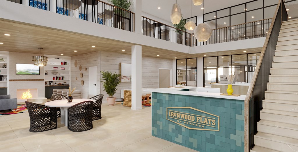 a communal area with a table and chairs and a fireplace at Ironwood Flats, Brandon, 33511