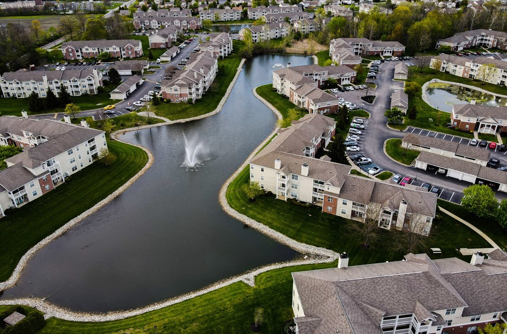 arial view of a subdivision with a lake and fountain at Latitudes Apartments, Indianapolis, IN