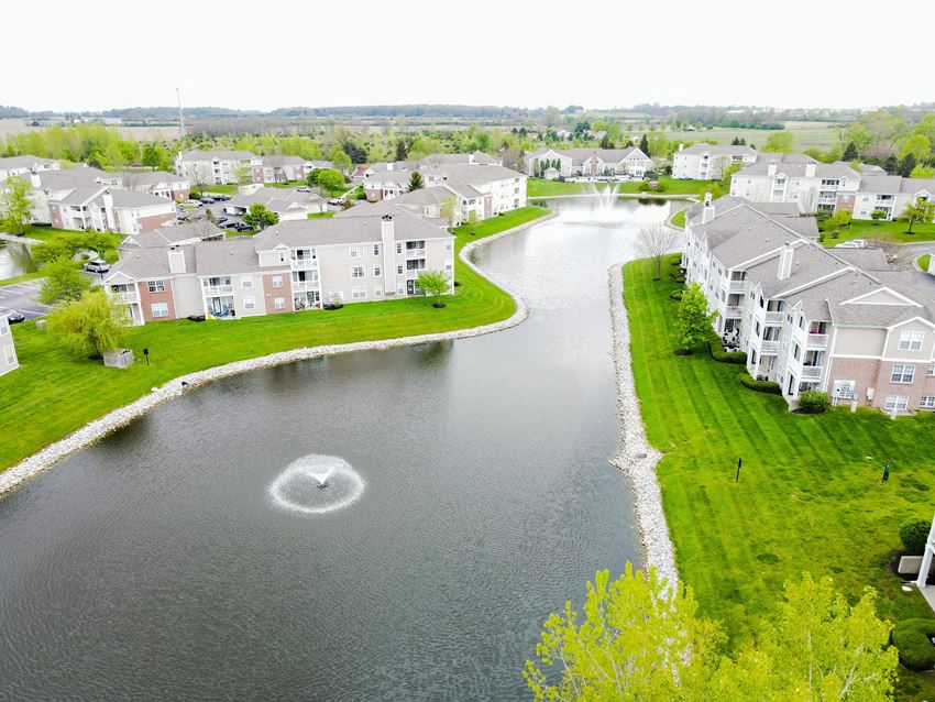 a aerial view of a lake with a fountain in the middle of it and a row of - Photo Gallery
