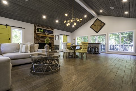 A modern living room with a white sofa and a coffee table.
