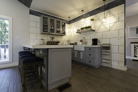 A kitchen with a bar area and a window.