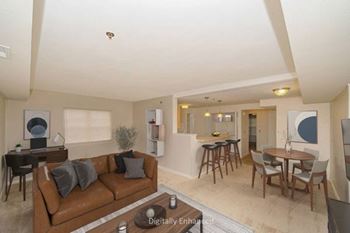 End with an enlarged living room with a door to a balcony at Limestone Creek Apartment Homes, Alabama, 35756