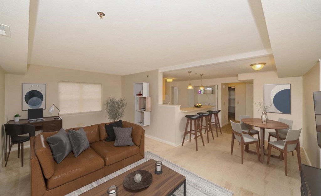 an end style living room and dining room with a couch and a table at Limestone Creek Apartment Homes, Madison, AL