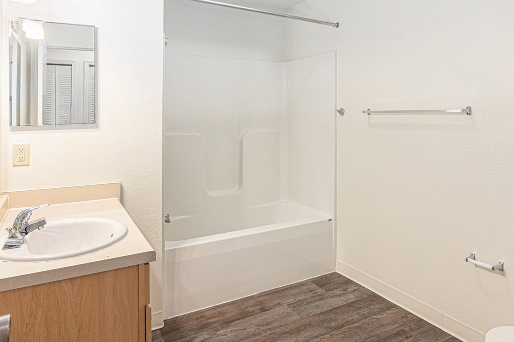 A bathroom with a sink and a bathtub/shower at Limestone Creek Apartment Homes, Madison, AL