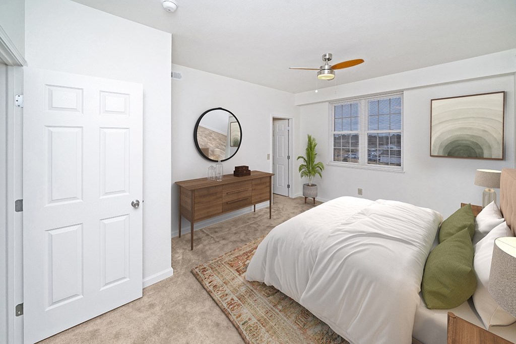 a bedroom with a large window and walk in closet at Limestone Creek Apartment Homes, Madison, AL