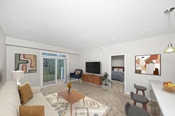 living room with a 9 foot ceiling to a private balcony at Limestone Creek Apartment Homes, Madison, Alabama, 35756