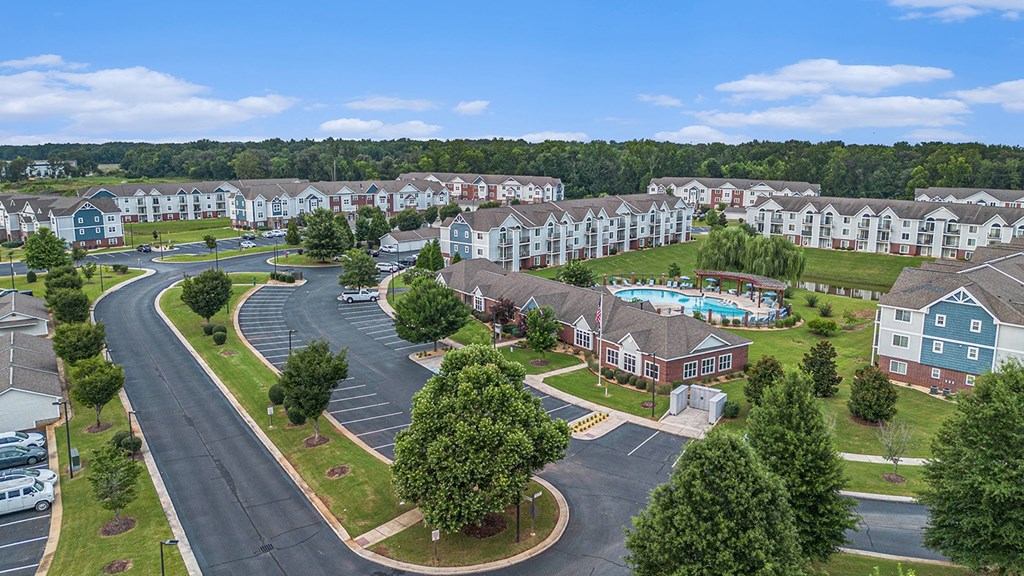 A large apartment complex with a swimming pool and an office/community building/fitness center at Limestone Creek Apartment Homes, Madison, AL