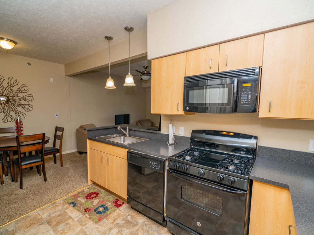 Kitchen With Cabinetry And Black Appliances at Lynbrook Apartment Homes and Townhomes, Nebraska, 68022