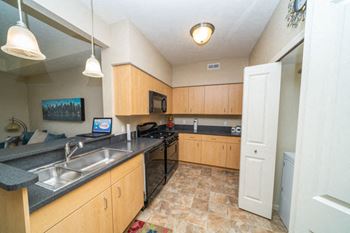 Kitchen with Breakfast Bar at Lynbrook Apartments and Townhomes in Elkhorn, Nebraska