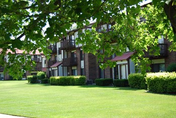Expertly Landscaped Grounds Expertly Landscaped Grounds at Madeira Apartments, Kalamazoo, MI - Photo Gallery 2