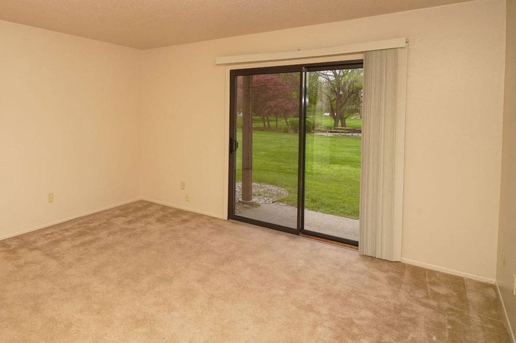 Spacious Living Room with a View at Madeira Apartments in Kalamazoo, MI