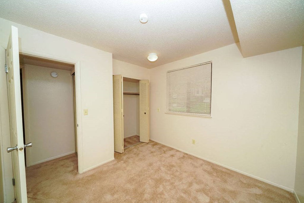 Bedroom with Large Closet at Madeira Apartments in Kalamazoo, MI