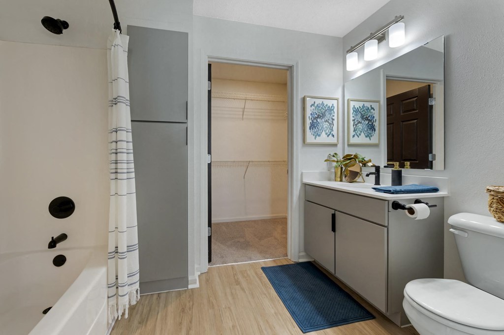 a bathroom with a sink toilet and shower in a 555 waverly unit at Latitudes Apartments, Indianapolis, Indiana