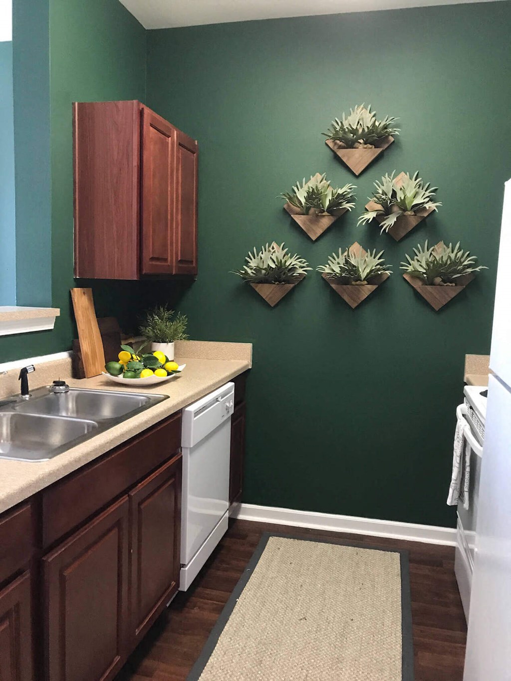 a kitchen with a sink and a dishwasher  at Enclave Apartments, Midlothian, 23114