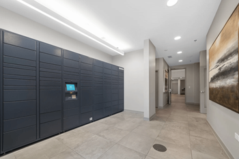 a row of lockers in the hallway of a building at Montgomery Place Apartments, Montgomery, IL